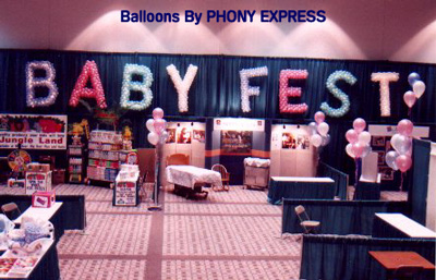 Lighted balloon letters spell out the convention name